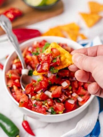 pico de gallo (mexican tomato salsa) in a bowl with tortilla chips