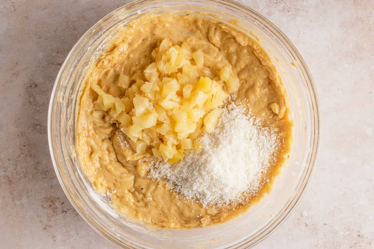 banana bread batter with coconut and pineapple pieces