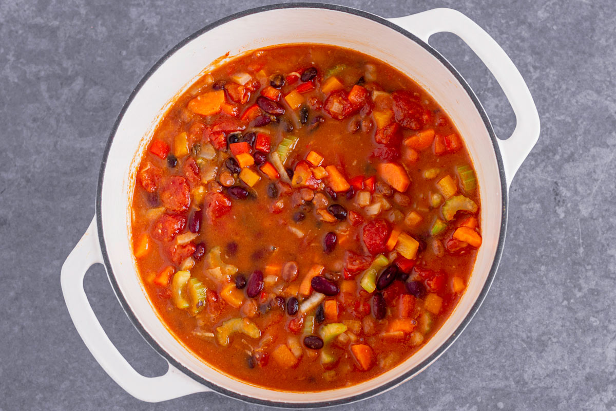 cooking pumpkin chili in a dutch oven