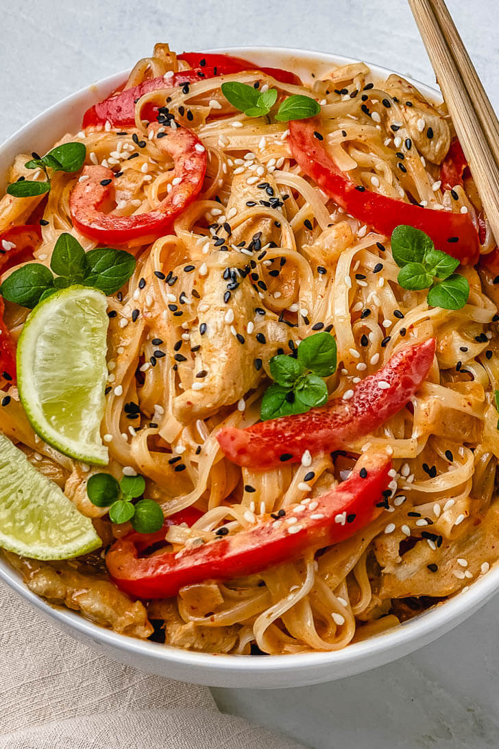 These Thai Red Curry Chicken Noodles are the perfect easy dinner recipe that will be ready in 15 minutes! This bowl of noodles is huge on flavor and is packed with bites of tender chicken, coconut milk, rice noodles, spices, and lime juice. Comforting, filling, and gluten free! 