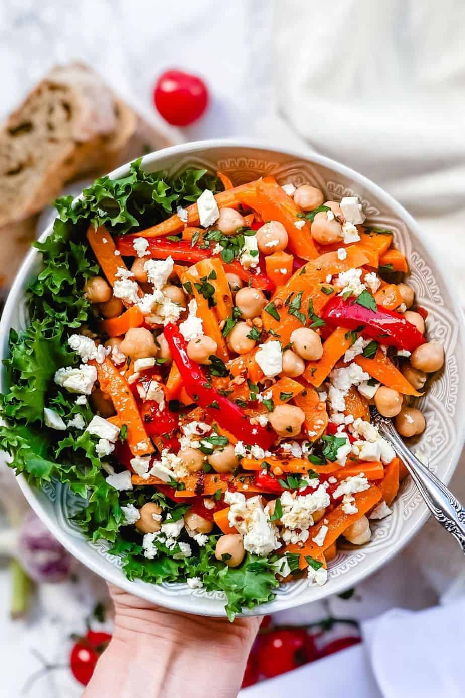 Roasted Pumpkin Chickpea and feta salad - A Delicious bowl of salad loaded with Pumpkins, bell peppers, carrots, Chickpeas and salty Feta. All this goodness is dressed in Maple Chili Dressing to add that little extra touch. -The Yummy Bowl