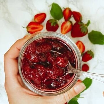 This homemade strawberry sauce is only 5 ingredients, and is the perfect berry topping to go on ice cream, cheesecake, pancakes, waffles, yogurt, biscuits and more!