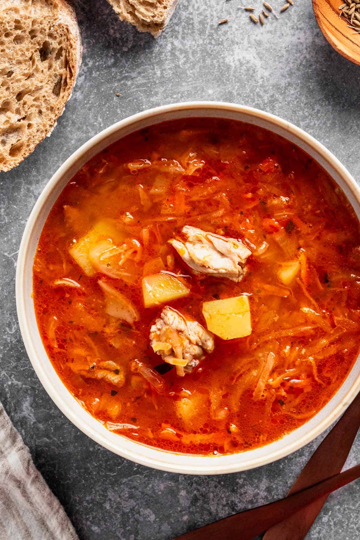 sauerkraut soup with meat in a bowl.