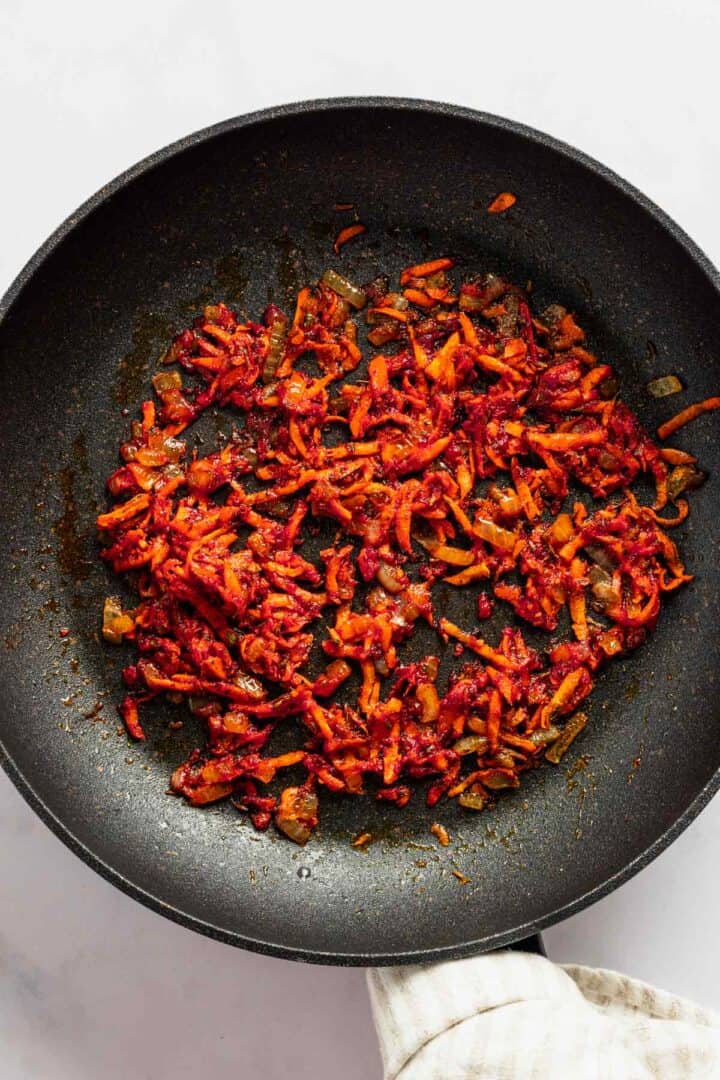 grated carrot mixed with tomato paste.