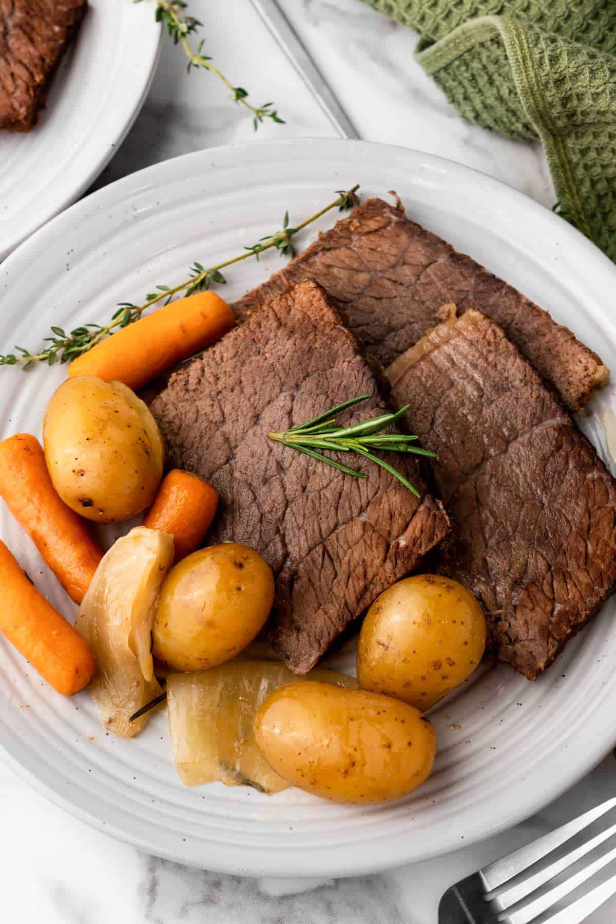 rump roast with vegetables on a plate