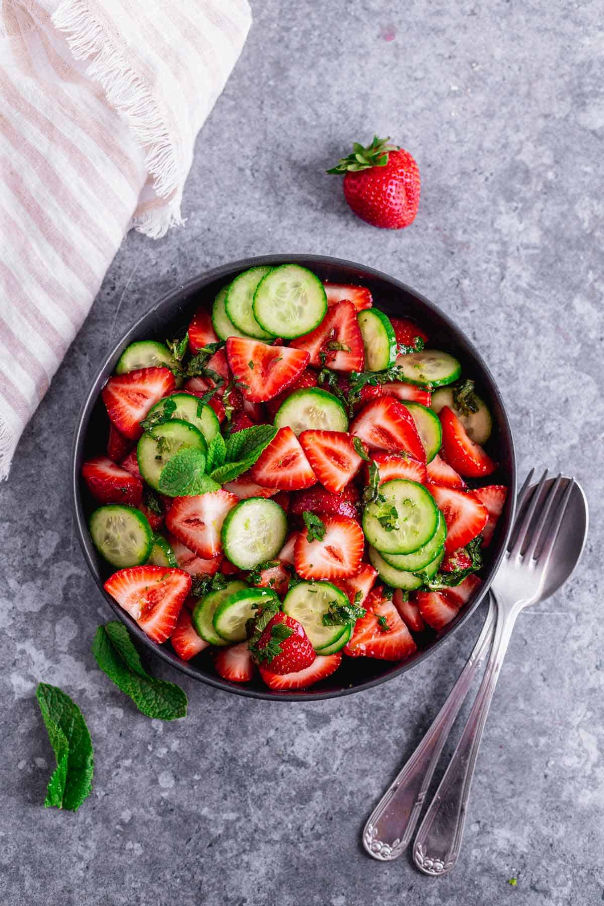 Cucumber Strawberry Salad in a black bowl