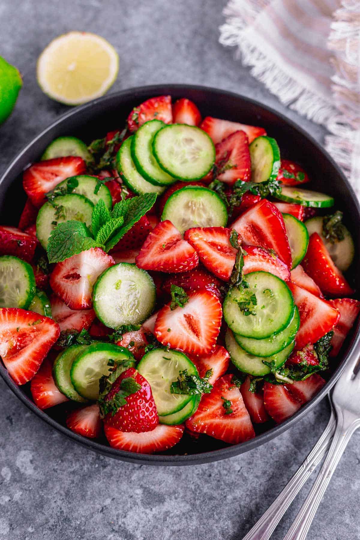 Cucumber Strawberry Salad in a black bowl