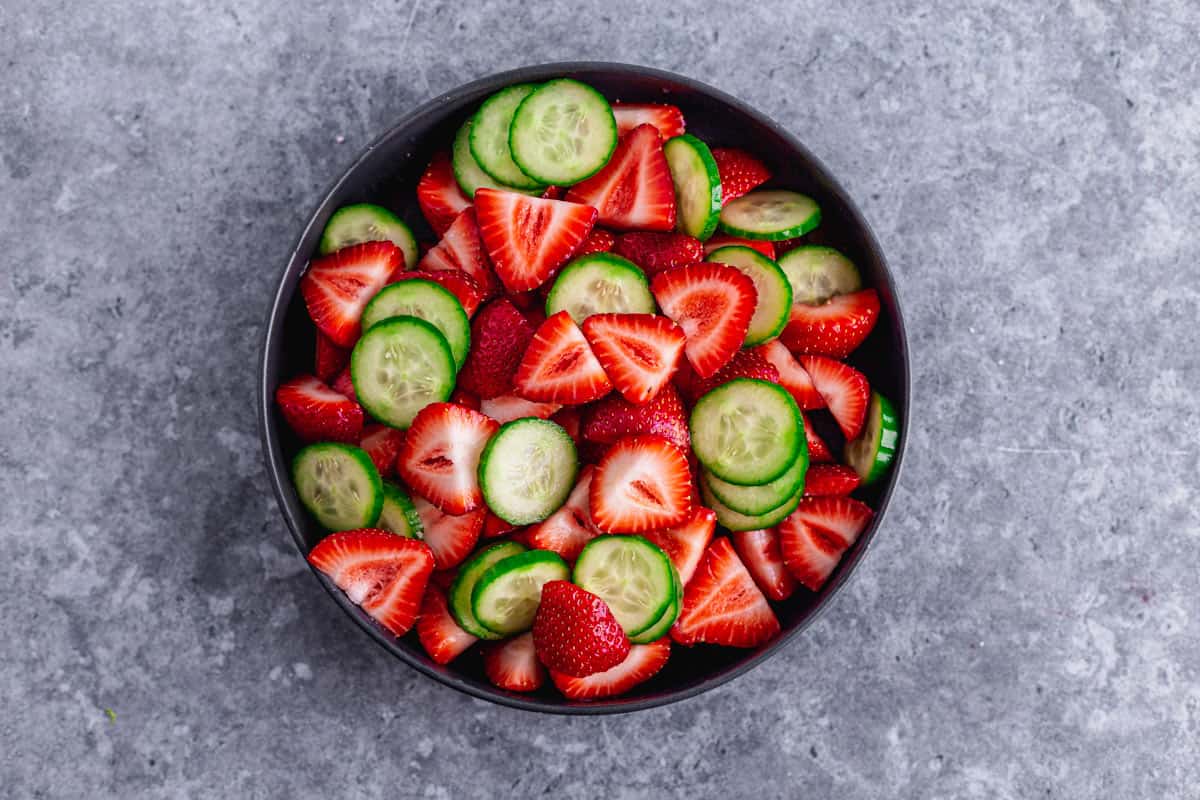 Cucumber Strawberry Salad in a black bowl