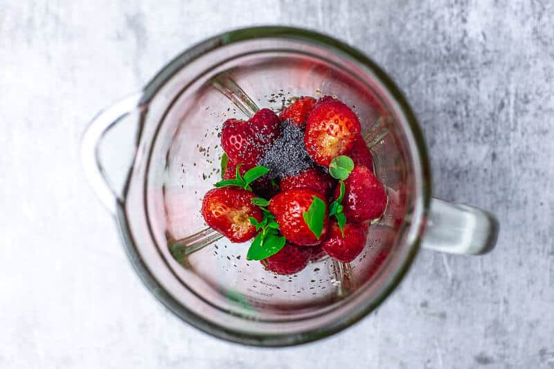 starwberries and poppy seeds in a blender