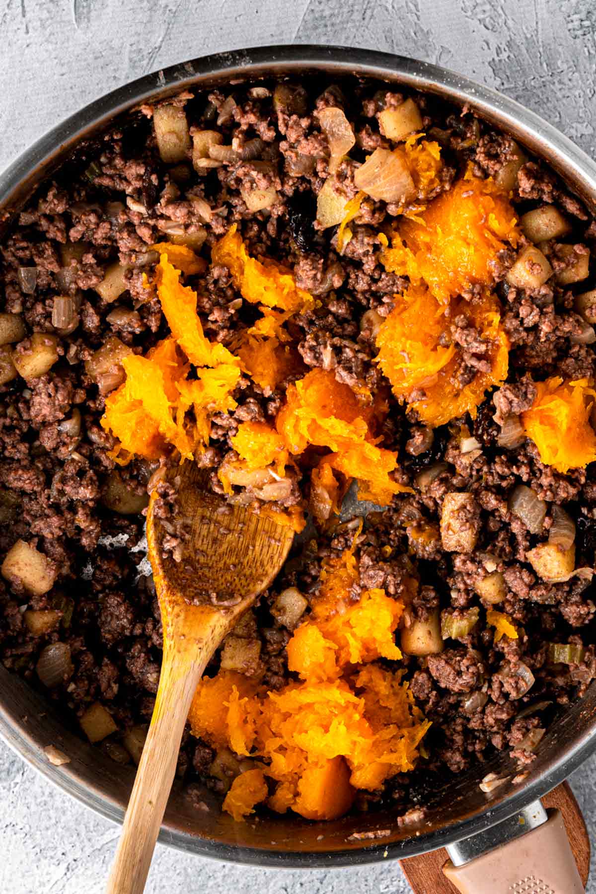 butternut squash puree and beef in skillet.