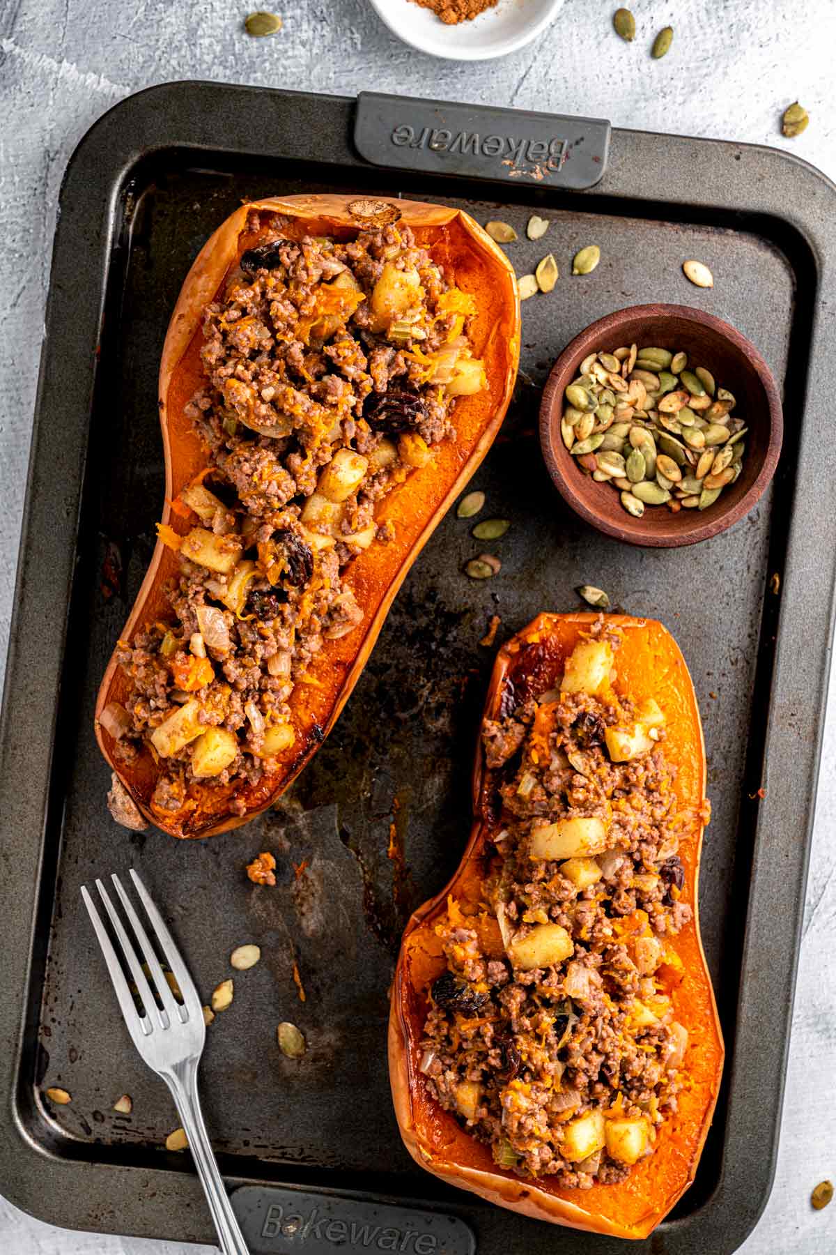 butternut squash halves with veggie and beef stuffing.