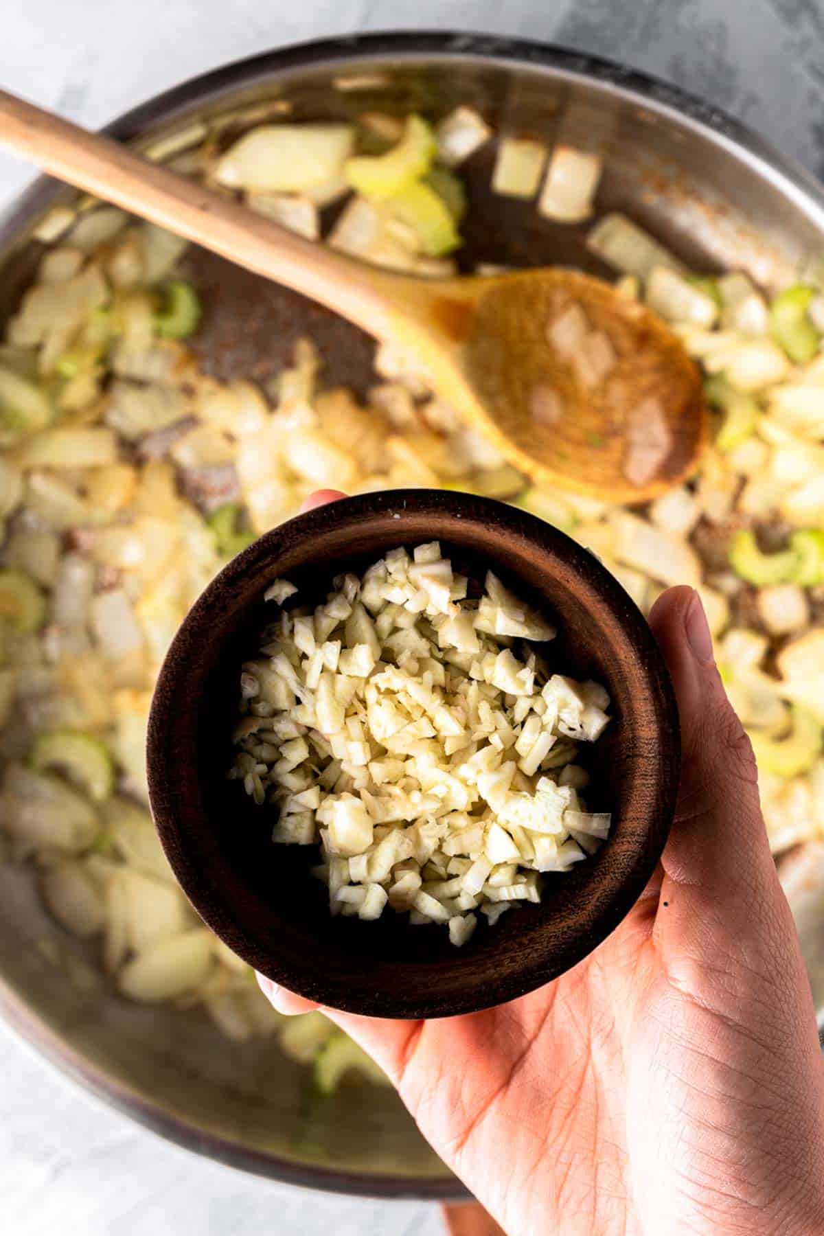 adding garlic to onions.