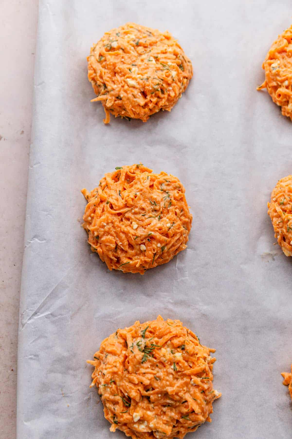 sweet potato patties on baking sheet.