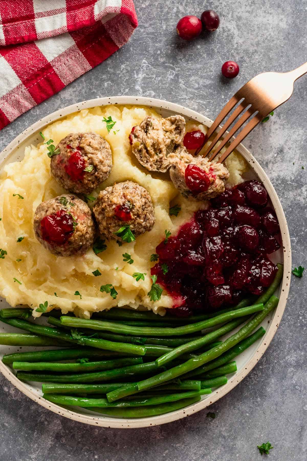 turkey stuffing meatballs served with cranberry sauce.