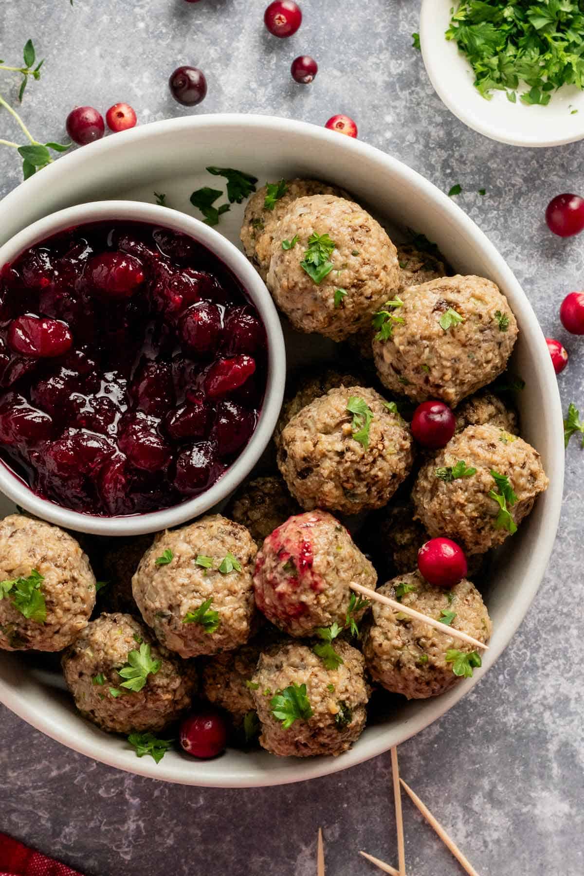 turkey stuffing meatballs served with cranberry sauce.