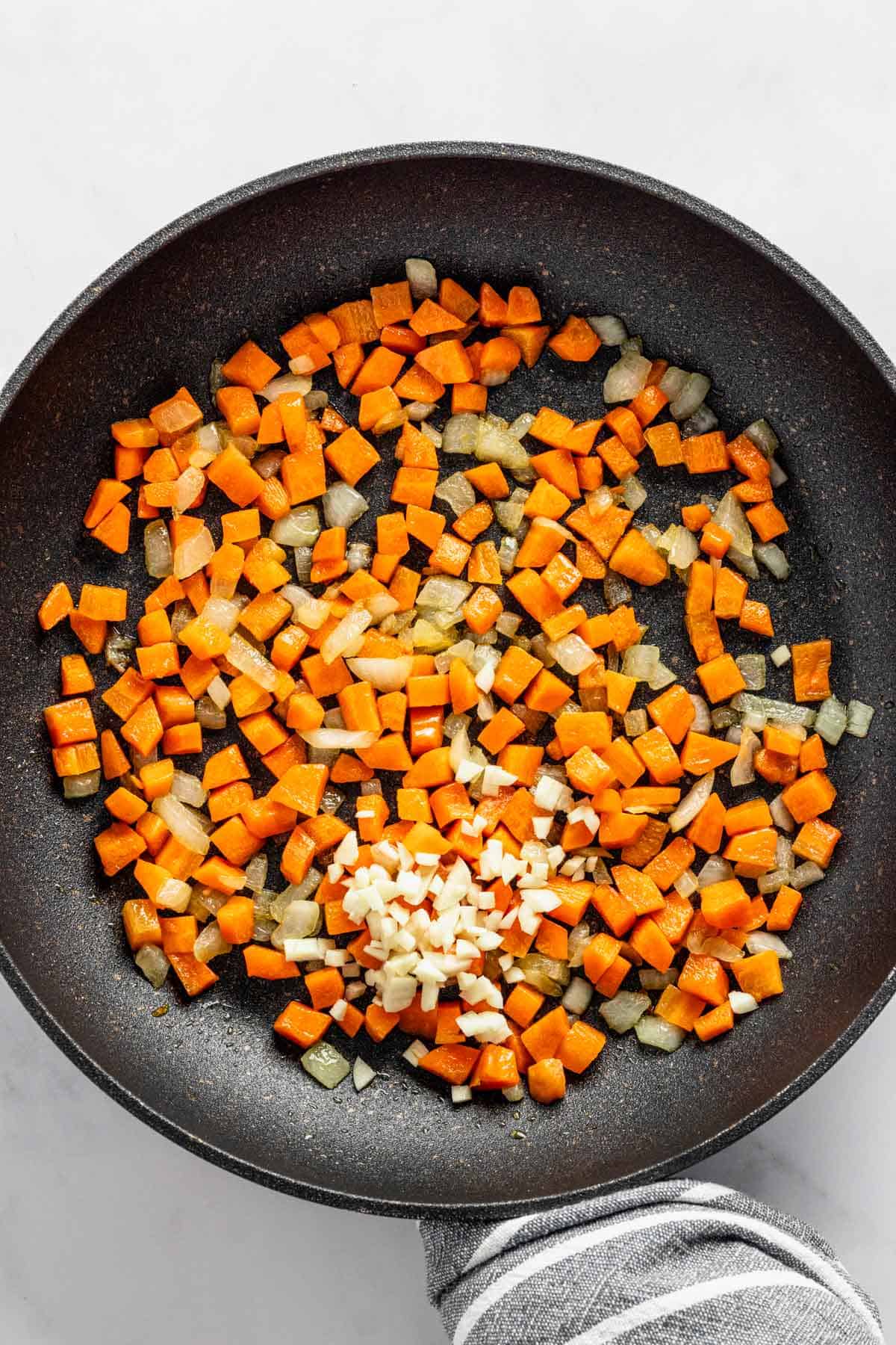 sauteeing carrots and onions.