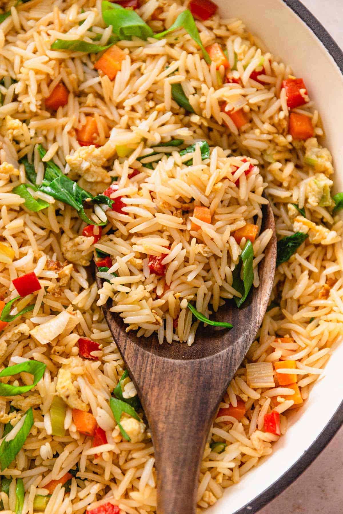 vegetable egg fried rice in white skillet