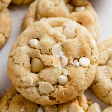 a stack of white chocolate macadamia nut cookies