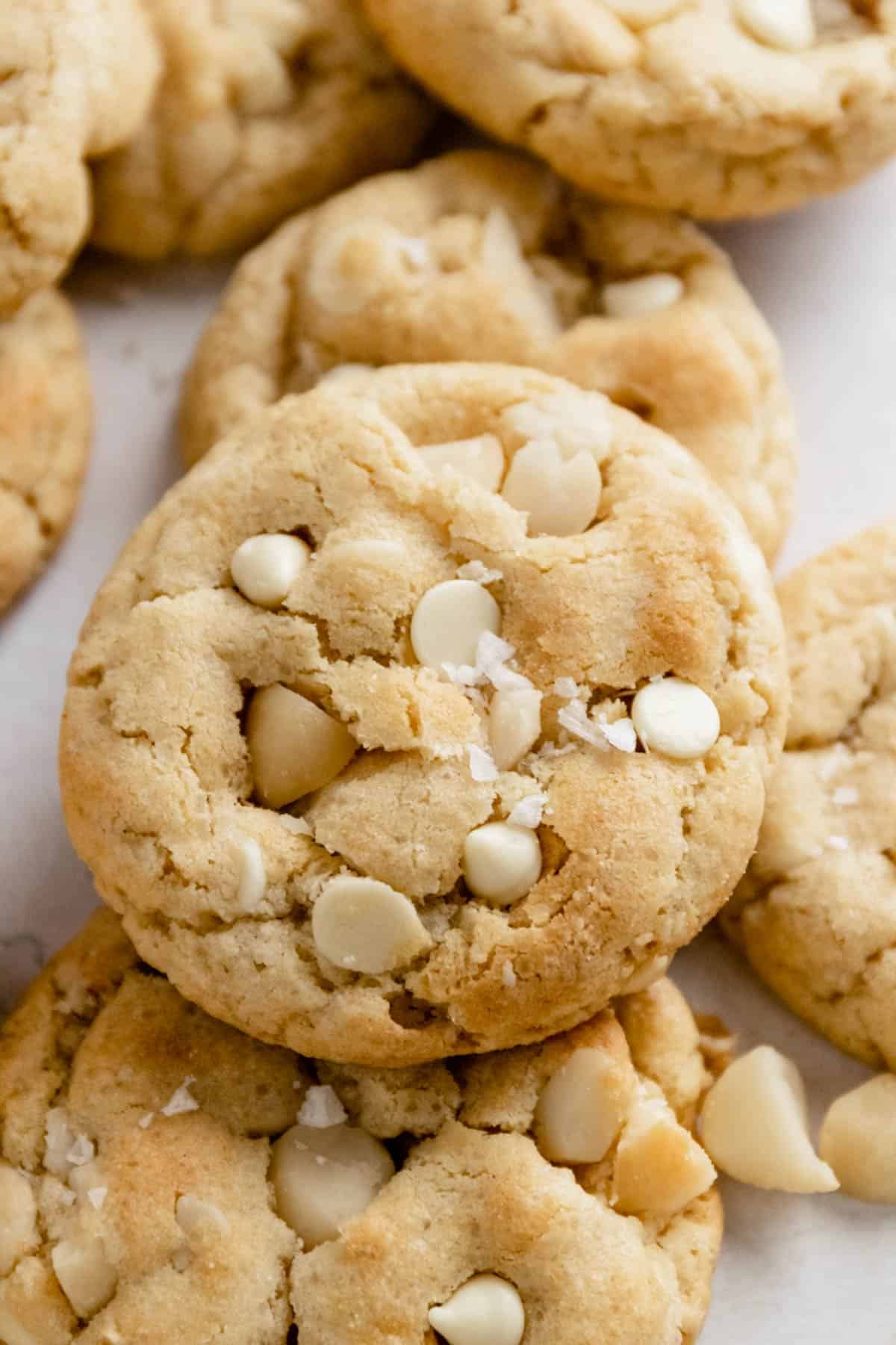 a stack of white chocolate macadamia nut cookies