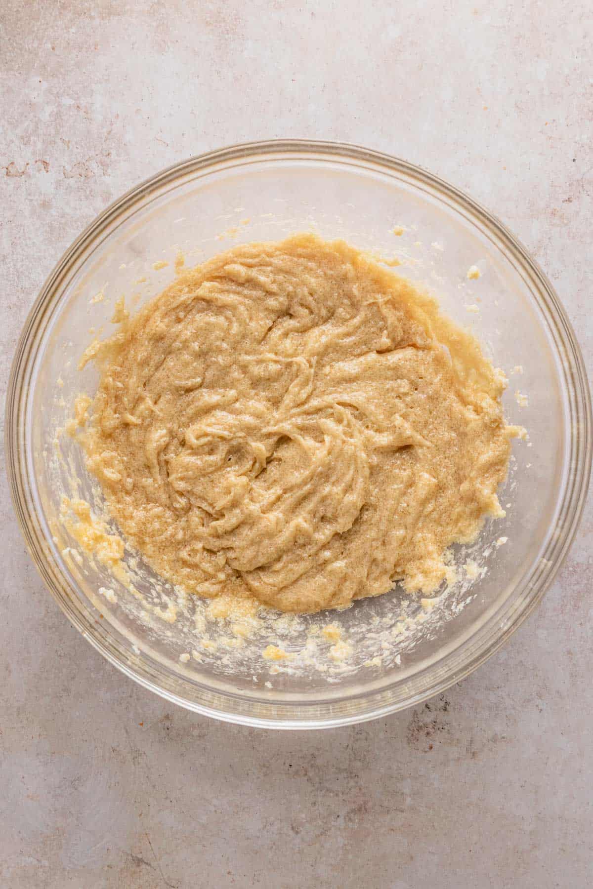 butter and eggs whisked in a bowl